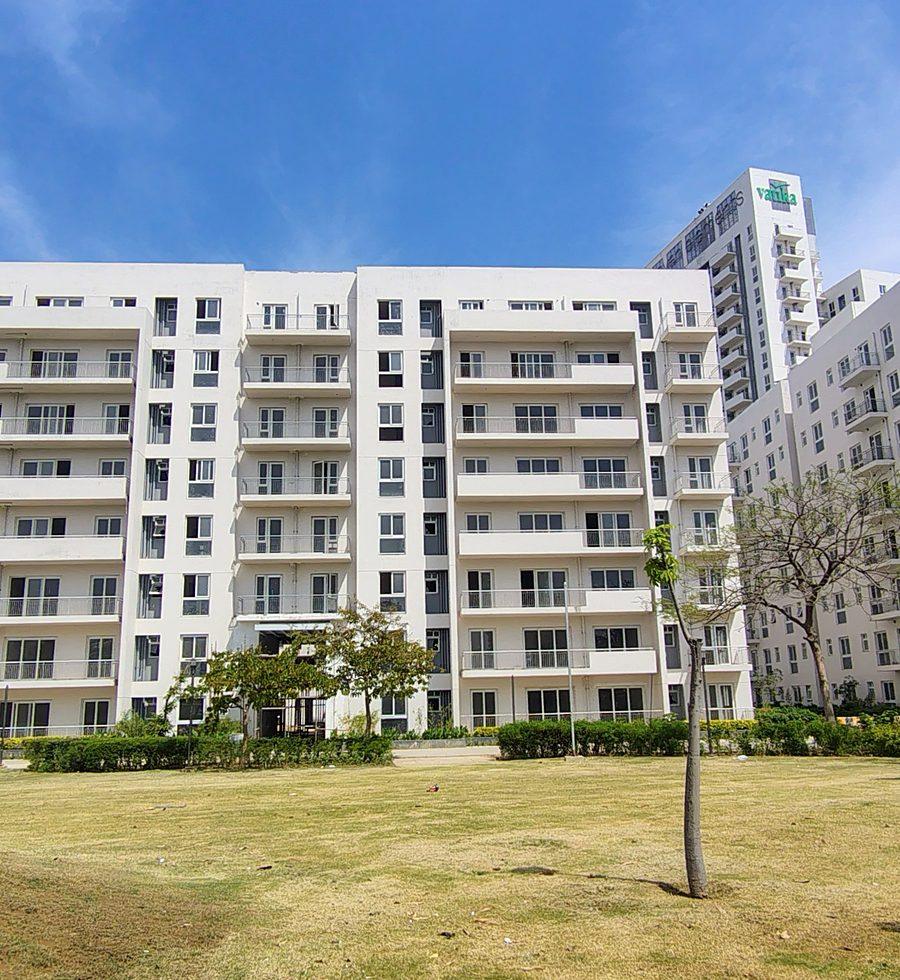 Completed Phase I blocks behind a landscaped lawn (actual image)